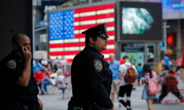 New York Police Department officers stand guard at Times Square in New York on July 4
