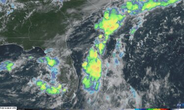 Stormy weather (indicated by the colored clouds) bubbles up near and over the Southeast on Thursday morning in the area the National Hurricane Center is keeping an eye on for tropical development.