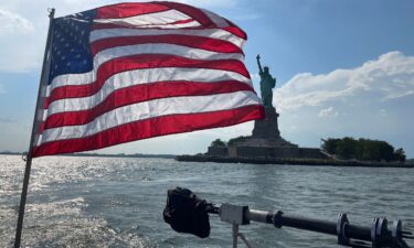 An American flag fles from the back of a NYPD boat on Thursday
