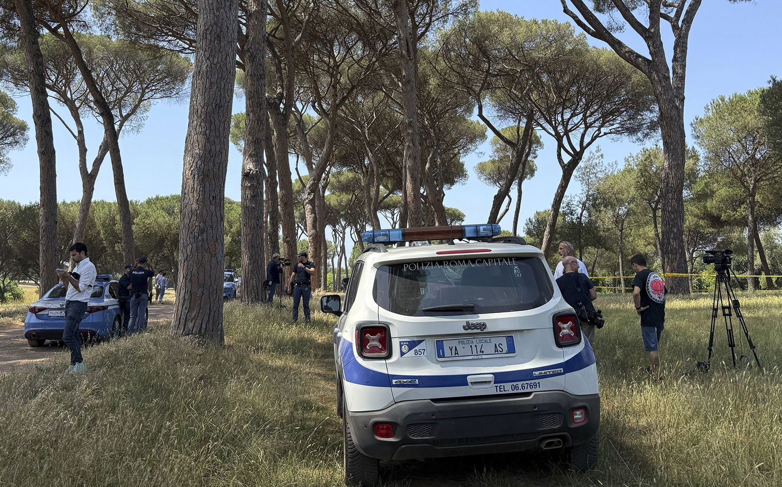 <i>Francesco Benvenuti/LaPresse/AP via CNN Newsource</i><br/>A police officer walks past a sealed-off area where forensic police work at the site of the discovery of the body of an infant and the infant’s mother