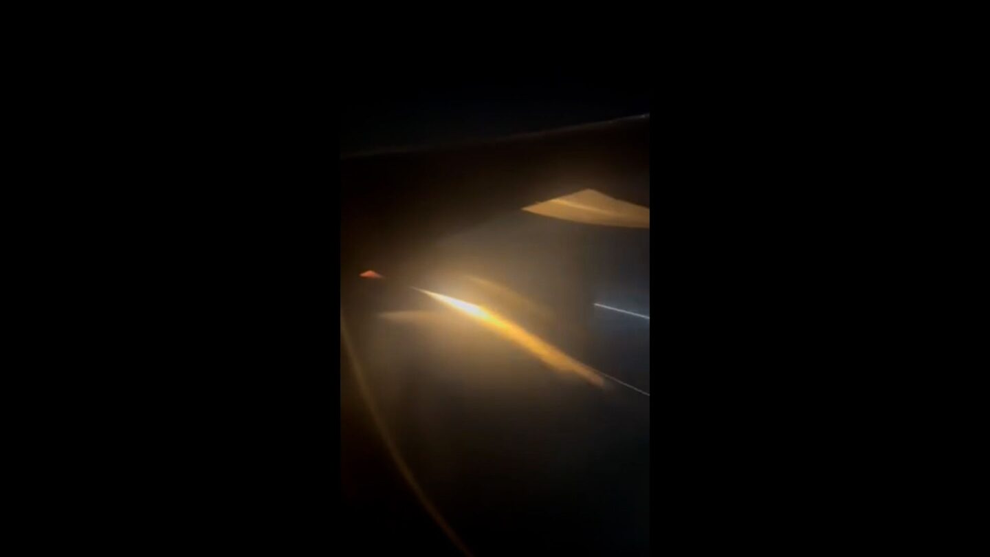 <i>Ruth Sorensen via CNN Newsource</i><br/>Flames streak from the right engine of Sun Country Flight 430 as it prepares to make an emergency landing at Los Angels International Airport on July 14 morning.