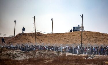 People carry a body as they mourn Palestinians who were killed in an incident on July 16 while seeking aid in Khan Younis in the southern Gaza Strip on July 16.