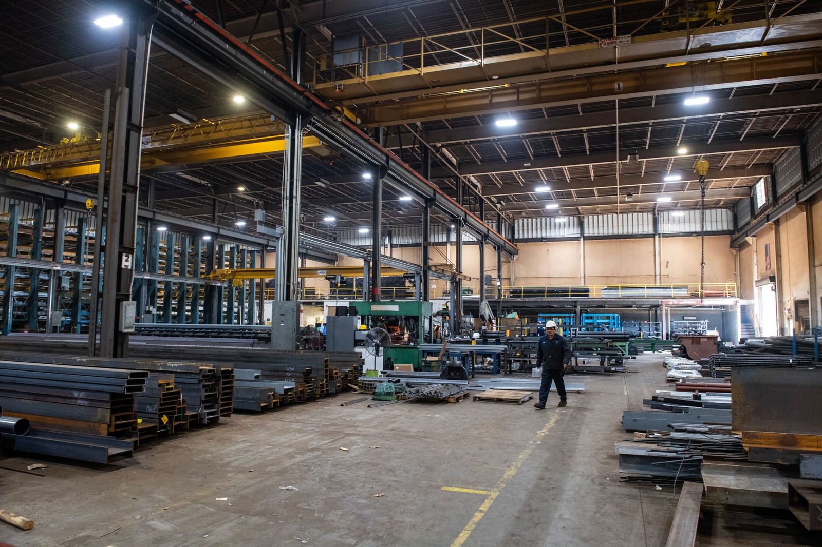 <i>Joseph Prezioso/AFP/Getty Images via CNN Newsource</i><br/>A worker walks through the warehouse at Central Steel Supply Company in Marlborough