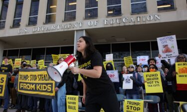 Demonstrators gather outside of the offices of the U.S. Department of Education in Washington