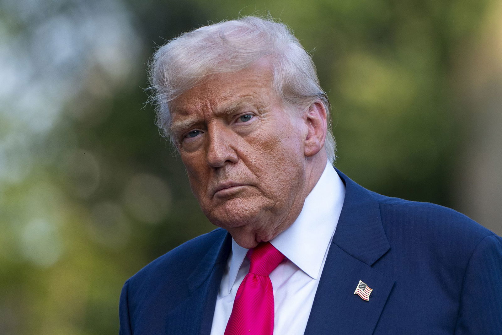 <i>Alex Brandon/AP via CNN Newsource</i><br/>President Donald Trump walks from Marine One after arriving on the South Lawn of the White House