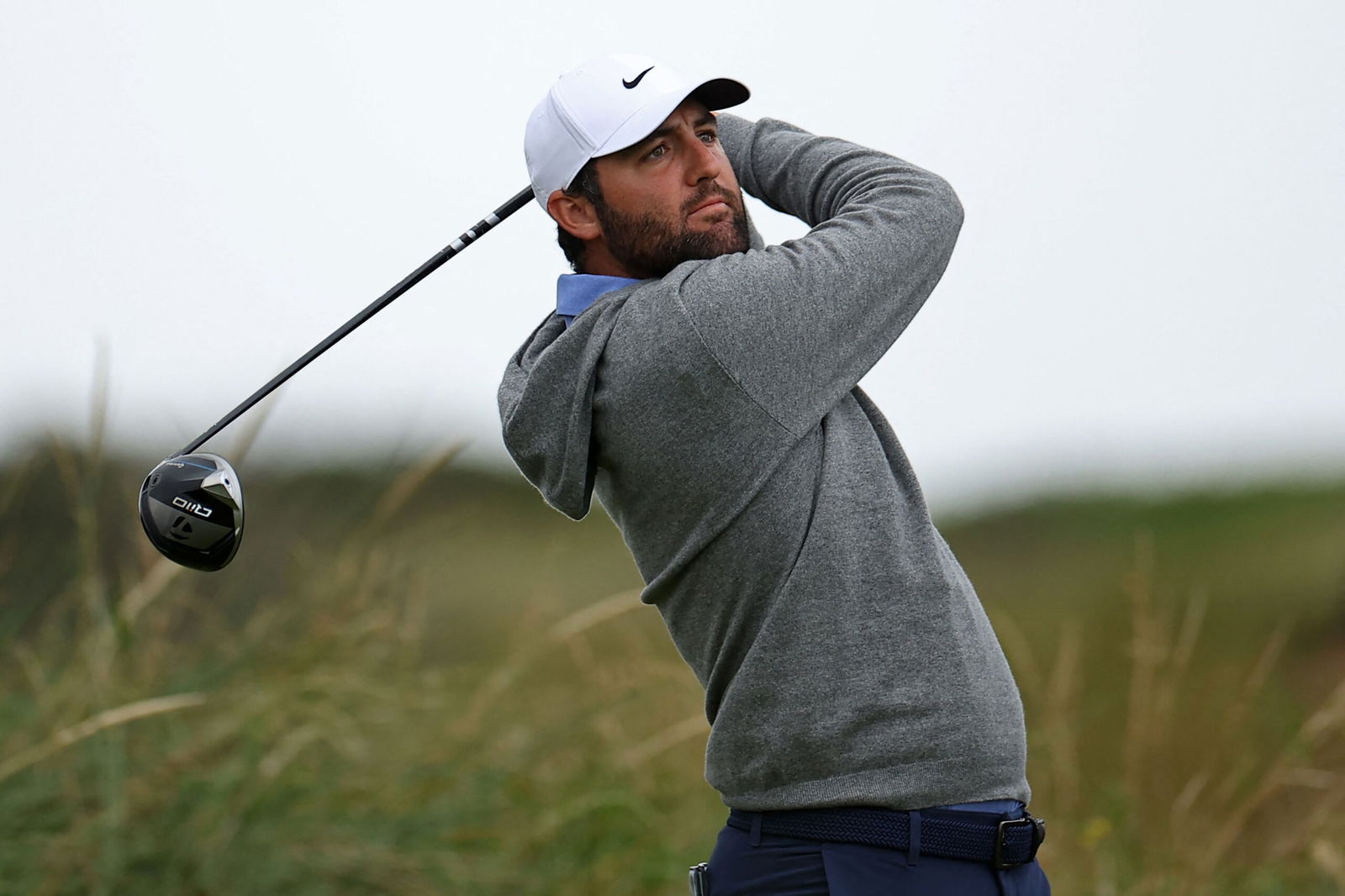 <i>Peter Morrison/AP via CNN Newsource</i><br/>Scheffler chipping during a practice round ahead of The 153rd Open Championship.