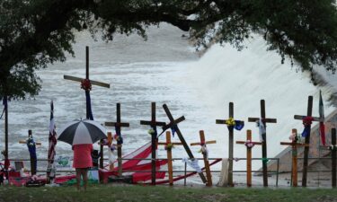 Rain falls over a makeshift memorial for flood victims along the Guadalupe River on July 13 in Kerrville