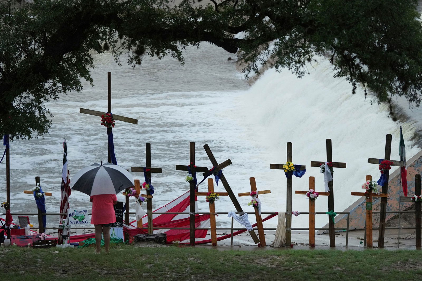 <i>Eric Gay/AP via CNN Newsource</i><br/>Rain falls over a makeshift memorial for flood victims along the Guadalupe River on July 13 in Kerrville
