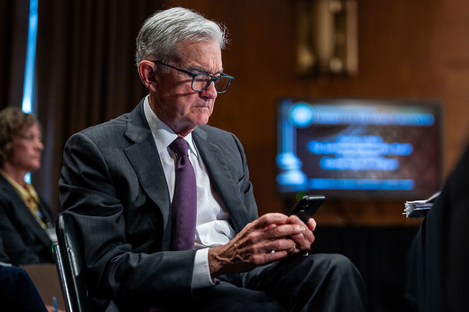 <i>Al Drago/Bloomberg/Getty Images/File via CNN Newsource</i><br/>Federal Reserve Chair Jerome Powell looks at a phone during a Senate Banking