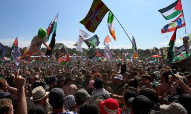 Revellers gather as Kneecap performs at Glastonbury Festival at Worthy Farm in Pilton