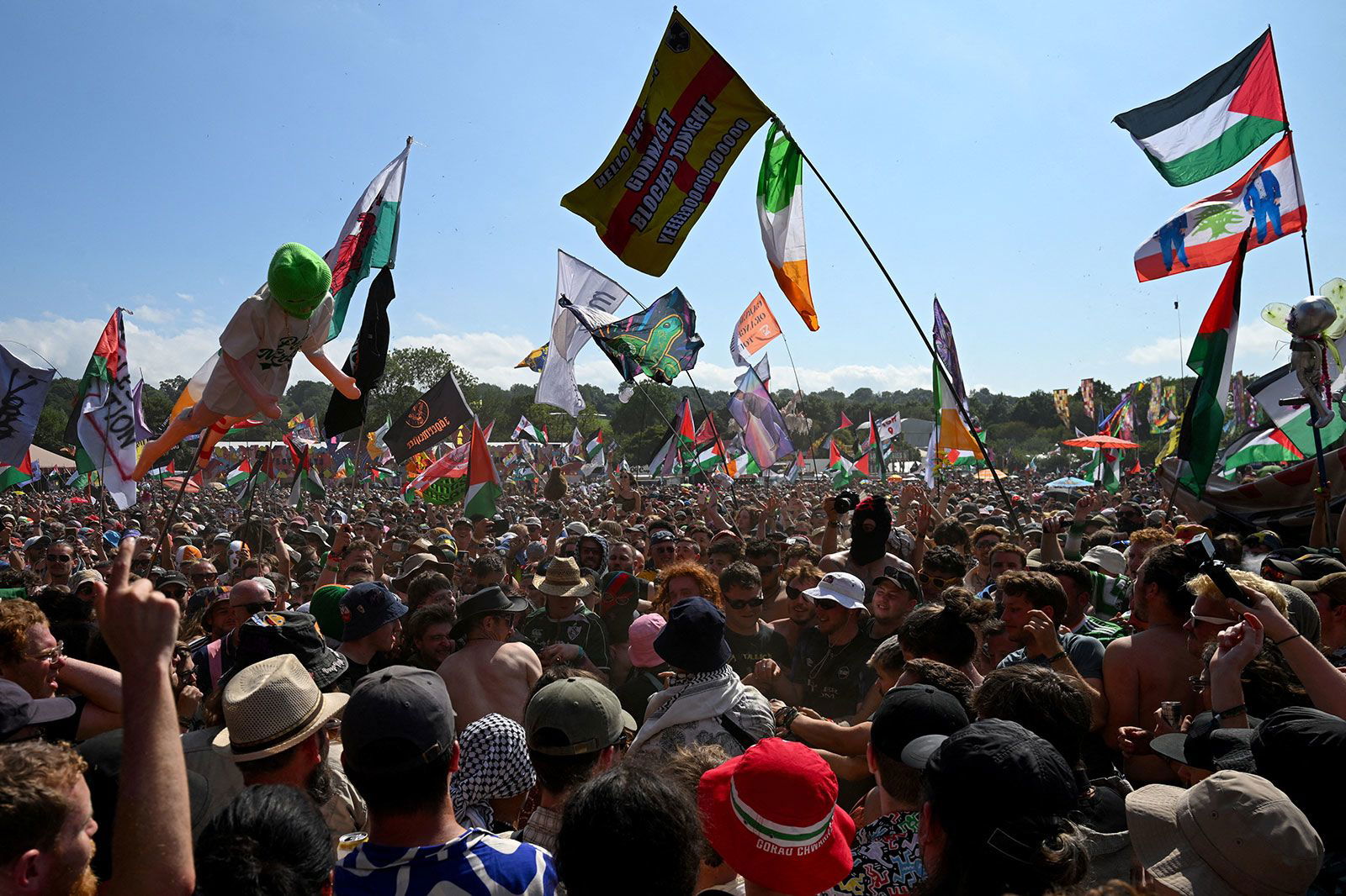 <i>Jaimi Joy/Reuters via CNN Newsource</i><br/>Revellers gather as Kneecap performs at Glastonbury Festival at Worthy Farm in Pilton