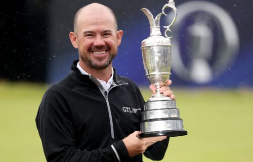 Harman poses with the Claret Jug after winning the 2023 Open Championship at Royal Liverpool Golf Club in Hoylake