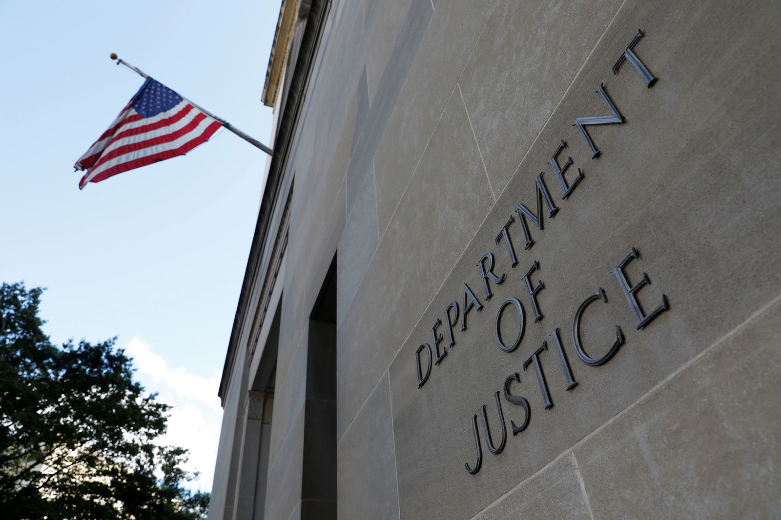 <i>Andrew Kelly/Reuters via CNN Newsource</i><br/>Signage is seen at the United States Department of Justice headquarters in Washington
