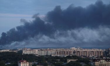 Smoke is seen in the city after a Russian drone and missile strike