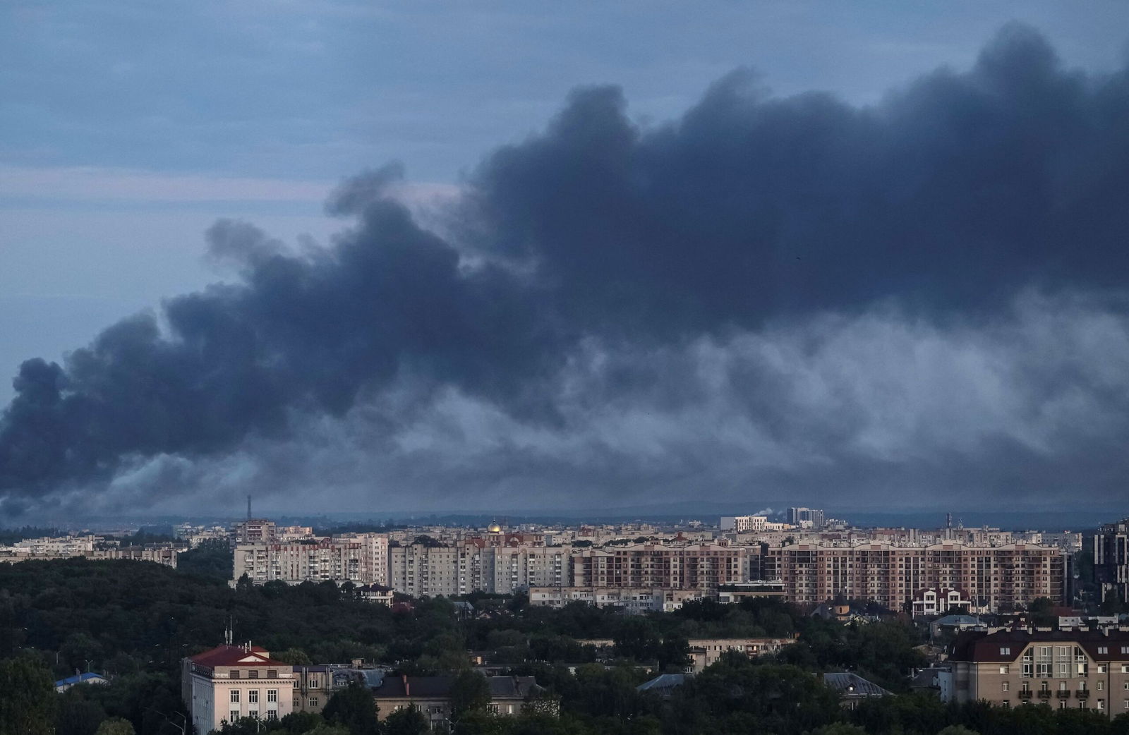 <i>Roman Baluk/Reuters via CNN Newsource</i><br/>Smoke is seen in the city after a Russian drone and missile strike