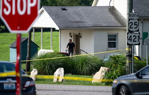 Police assess the scene after a shooting at Richmond Road Baptist Church on July 13