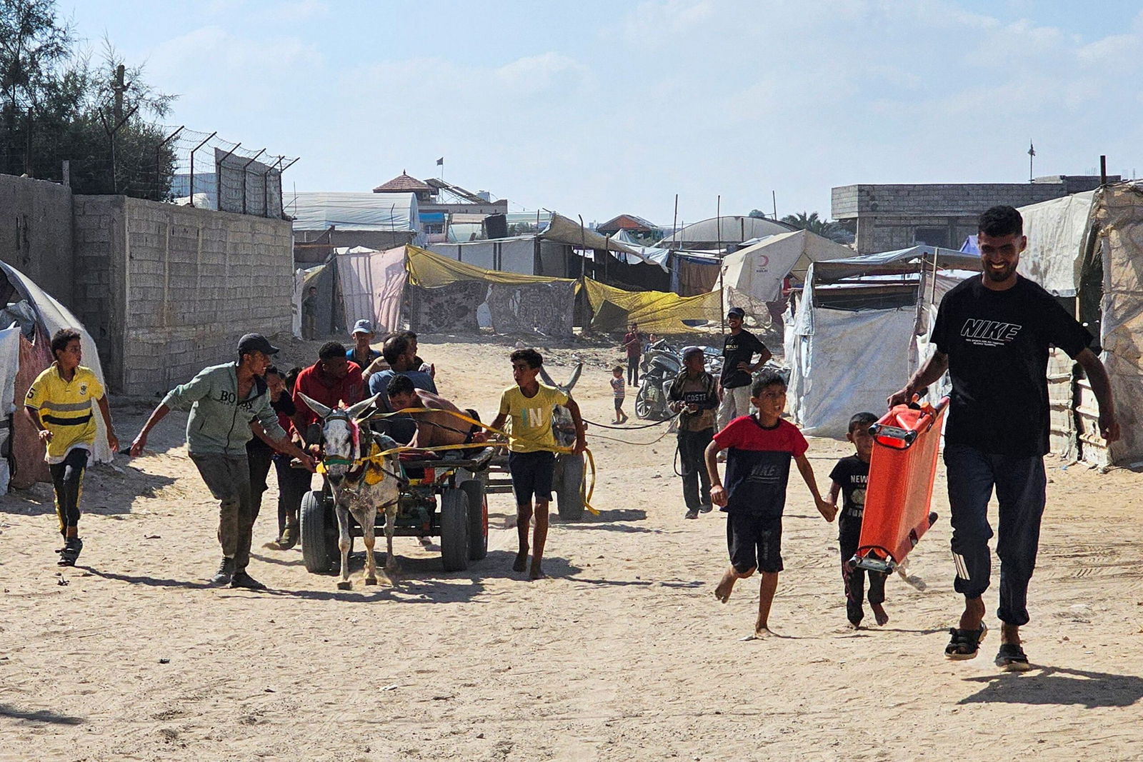 <i>AFP/Getty Images via CNN Newsource</i><br/>Palestinians in the southern Gaza Strip transport people who were injured while trying to get humanitarian aid on July 20.