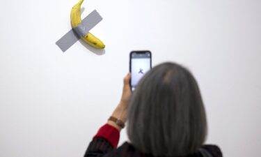 "Comedian" by Italian artist Maurizio Cattelan is pictured. Italian artist Maurizio Cattelan’s artwork featuring a fresh banana taped to a wall has been eaten by a visitor to a museum in France.