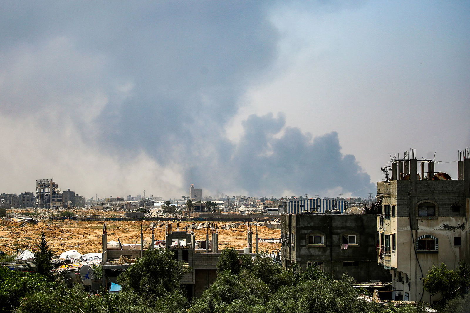 <i>Eyad Baba/AFP/Getty Images via CNN Newsource</i><br/>Smoke billows from Israeli bombardment as pictured from Deir al-Balah in the central Gaza Strip on July 21.