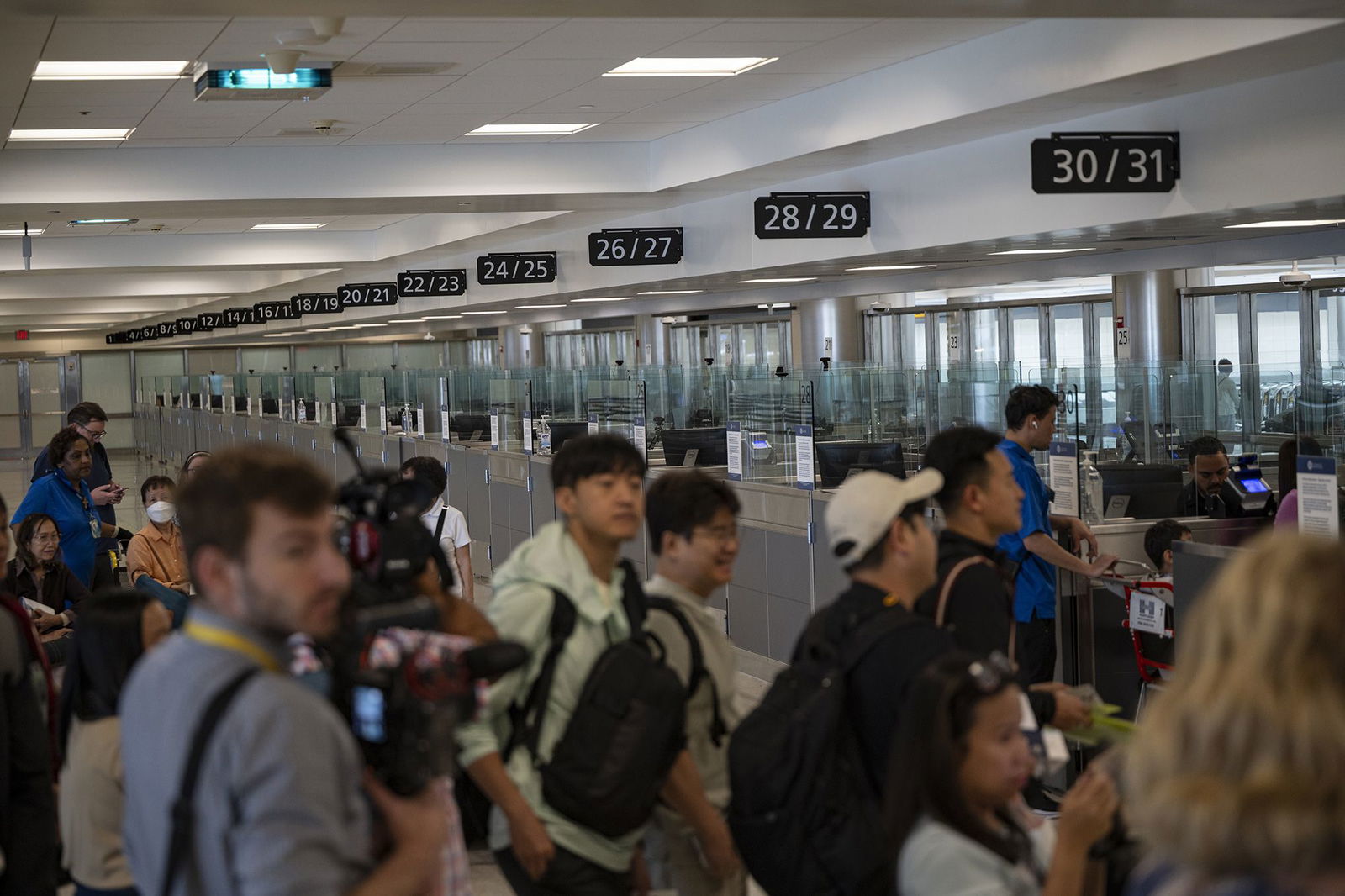 <i>Celal Gunes/Anadolu Agency/Getty Images via CNN Newsource</i><br/>Travelers at Dulles International Airport in Virginia are pictured during a media event related to incoming foreign nationals on June 29. The United States will require international visitors to pay a new “visa integrity fee” of at least $250.