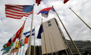 An American flag flies outside the headquarters of the United Nations Educational