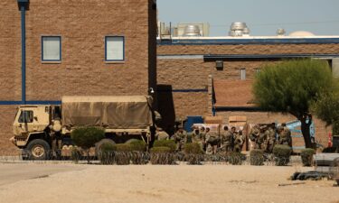 Members of the California National Guard load a truck outside the private prison company GEO Group Adelanto ICE Processing Center detention facility in Adelanto