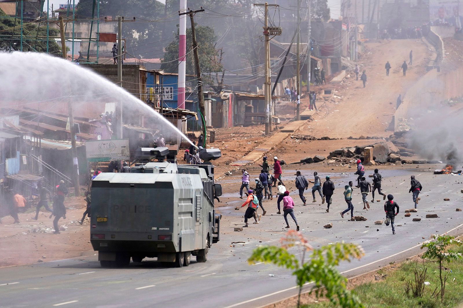 <i>Brian Inganga/AP via CNN Newsource</i><br/>Riot police scatter protesters with water cannons during demonstrations to mark the historic 1990 Saba Saba protests for democratic reforms in the Kangemi slum of Nairobi