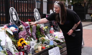 Fans left floral tributes beside the Sabbath Wall in Birmingham