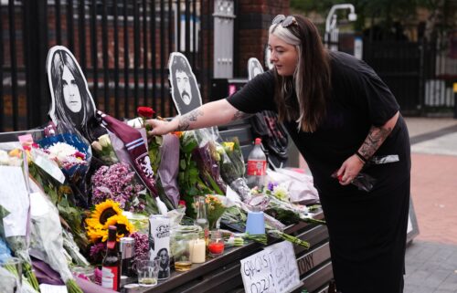 Fans left floral tributes beside the Sabbath Wall in Birmingham