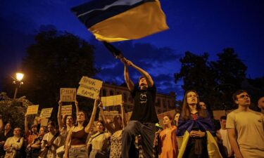 Ukrainians attend a rally against the new law in central Lviv