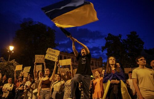 Ukrainians attend a rally against the new law in central Lviv