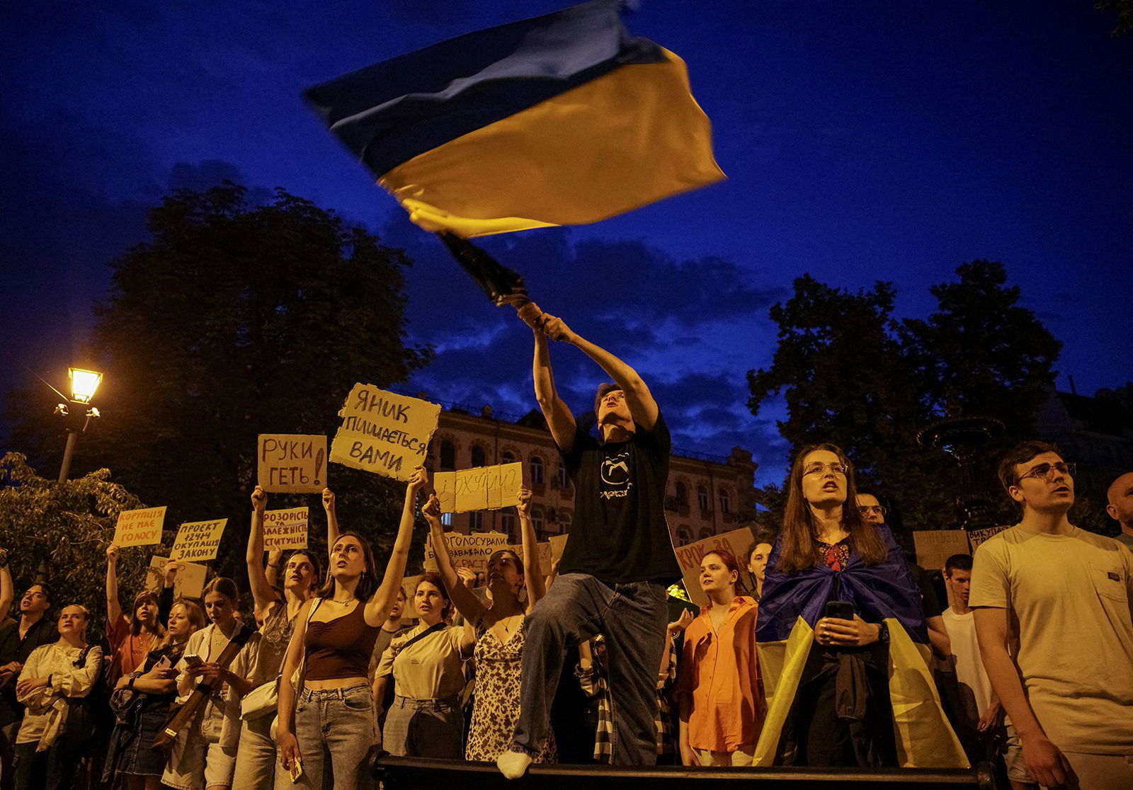 <i>Roman Baluk/Reuters via CNN Newsource</i><br/>Ukrainians attend a rally against the new law in central Lviv