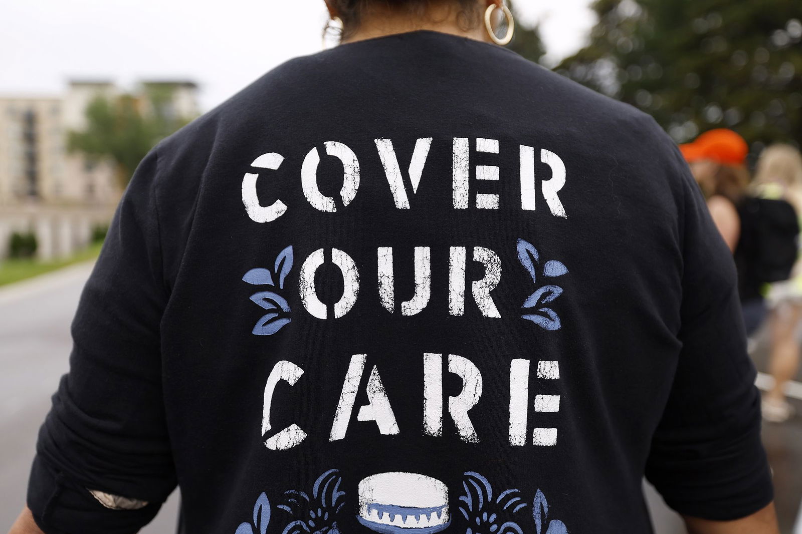 <i>David Berding/Getty Images for People's Action via CNN Newsource</i><br/>Health care advocates protesting care denials at UnitedHealthcare on July 15