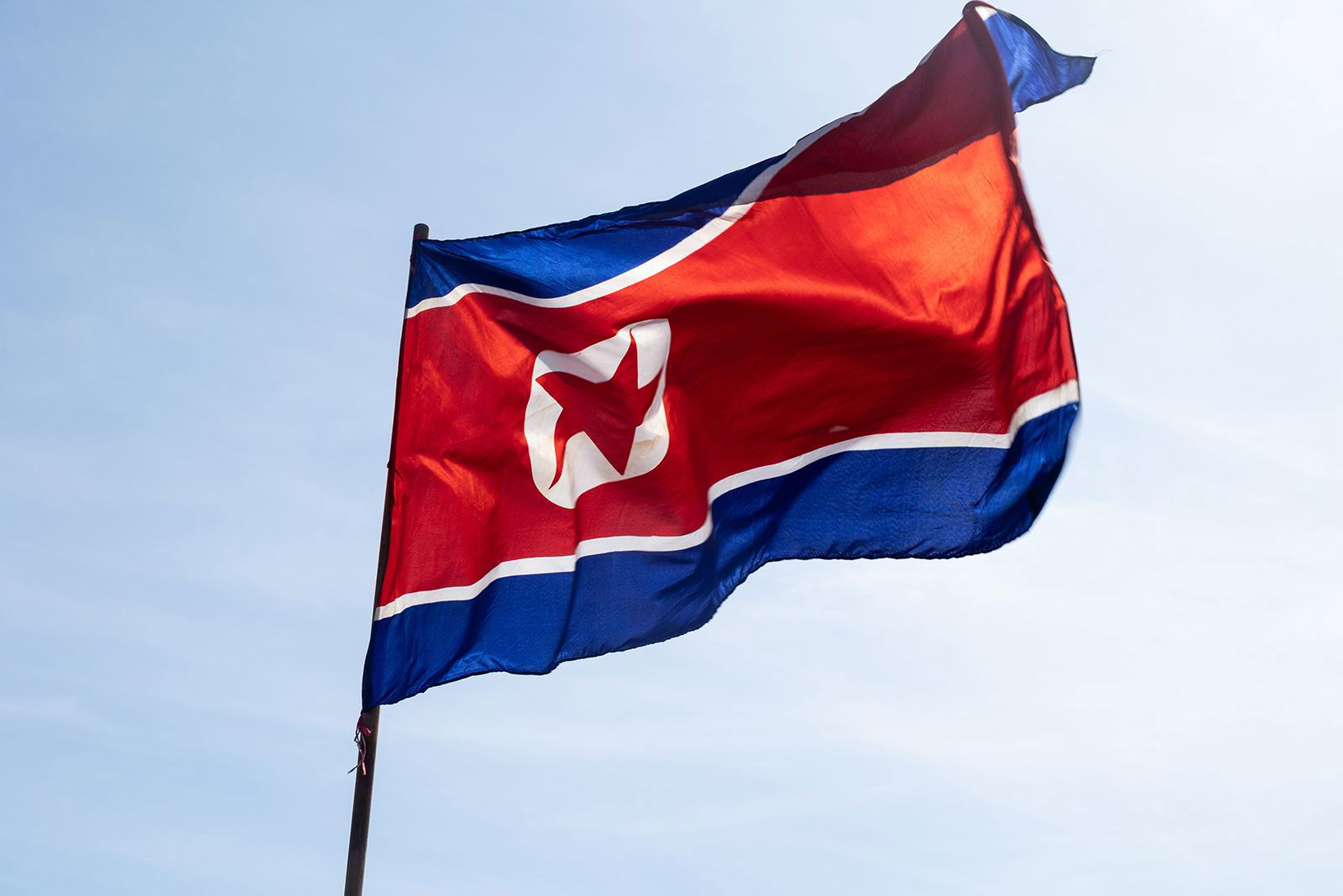 <i>Kristian Tuxen Ladegaard Berg/SOPA Images/LightRocket/Getty Images via CNN Newsource</i><br/>The national flag of North Korea seen during the celebration of International Workers' Day.