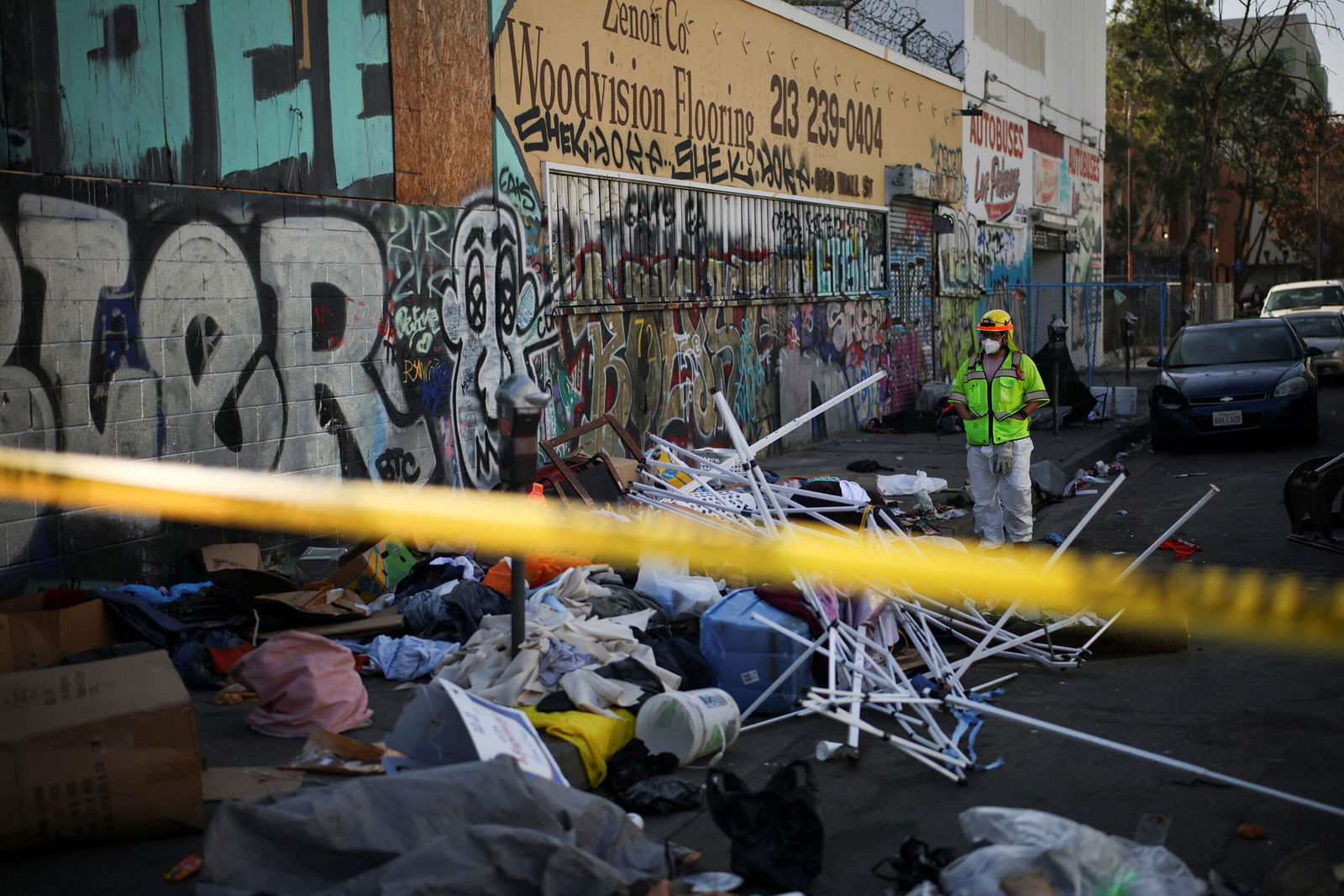 <i>Clifford Oto/The Stockton Record/USA Today Network/Imagn via CNN Newsource</i><br/>Stockton Police officers watch as inhabitants of a homeless encampment on an island on White Slough move their possessions onto a levee along Trinity Parkway near McAuliffe Road in north Stockton