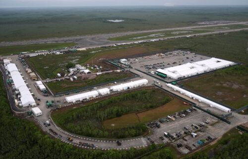 Work progresses July 4 on a new migrant detention facility dubbed "Alligator Alcatraz" at Dade-Collier Training and Transition facility in the Florida Everglades. Deportation flights from the makeshift South Florida immigration detention facility have begun