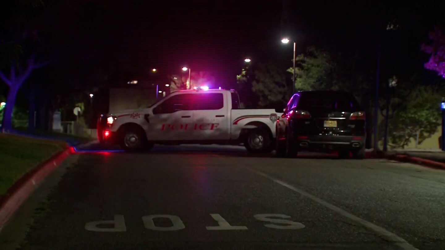 <i>KOAT via CNN Newsource</i><br/>Police are seen at the scene of a shooting at The University of New Mexico on July 25 in Albuquerque.