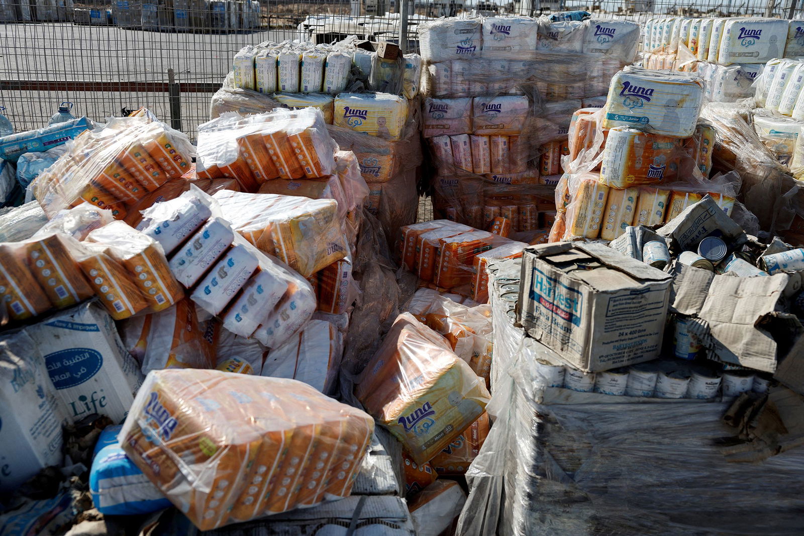 <i>Amir Cohen/Reuters via CNN Newsource</i><br/>This photo reviewed by the Israel Defense Forces shows parcels of humanitarian aid await transfer into Gaza at the Gaza side of the Kerem Shalom crossing in the Gaza Strip on July 24.