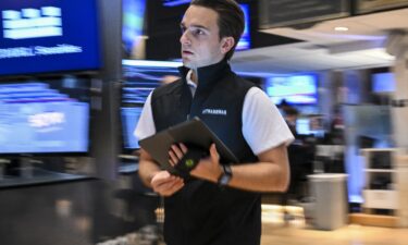 A trader works on the floor of the New York Stock Exchange (NYSE) at the opening bell on July 15.