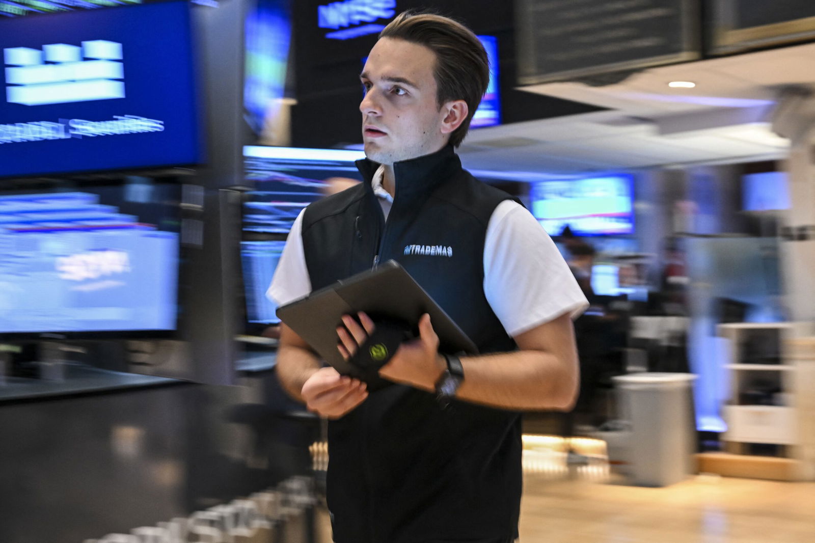 <i>Anglea Weiss/AFP/Getty Images via CNN Newsource</i><br/>A trader works on the floor of the New York Stock Exchange (NYSE) at the opening bell on July 15.