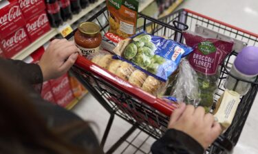 A shopper pushes a cart of groceries at a supermarket in Bellflower