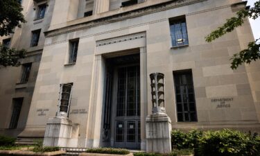 The Justice Department has fired two senior antitrust attorneys who disagreed with the handling of a merger between two powerhouse companies