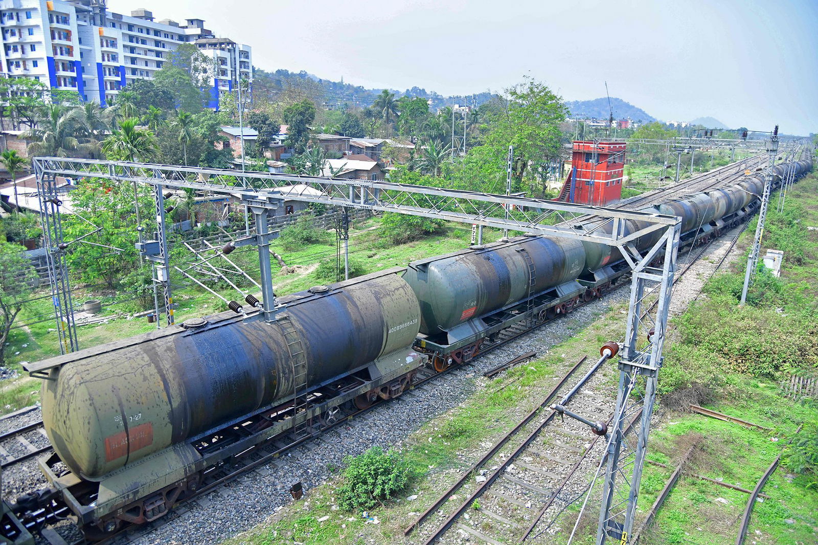 <i>Biju Boro/AFP/Getty Images via CNN Newsource</i><br/>An oil tankers train passes near the Guwahati Refinery operated by Indian Oil Corporation.