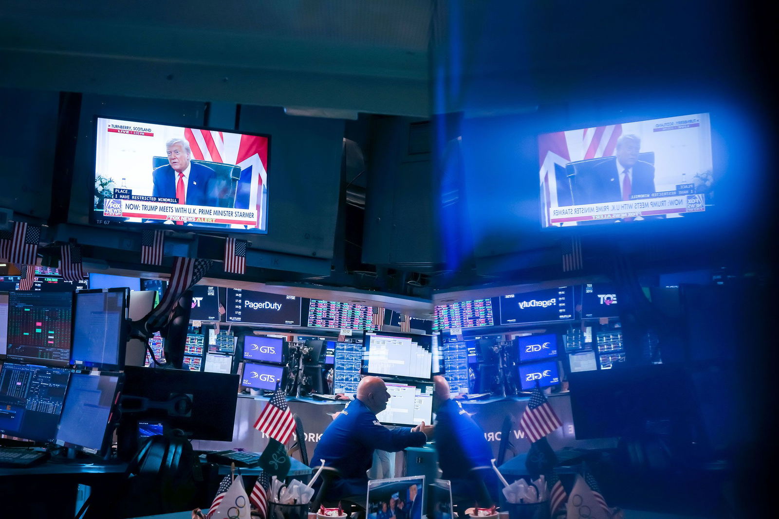 <i>Michael Nagle/Bloomberg/Getty Images via CNN Newsource</i><br/>A television broadcast shows President Donald Trump on the floor of the New York Stock Exchange on July 28.