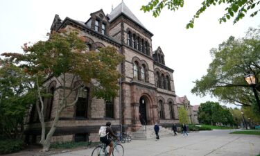 People travel through Brown University's campus in Providence