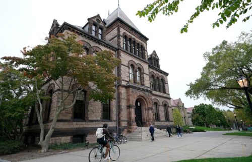 People travel through Brown University's campus in Providence