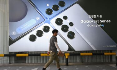 Samsung Electronics employees check the smartphone Galaxy S25 series at a Samsung store in Seoul