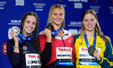 McIntosh tops the podium alongside Smith and Dekkers.