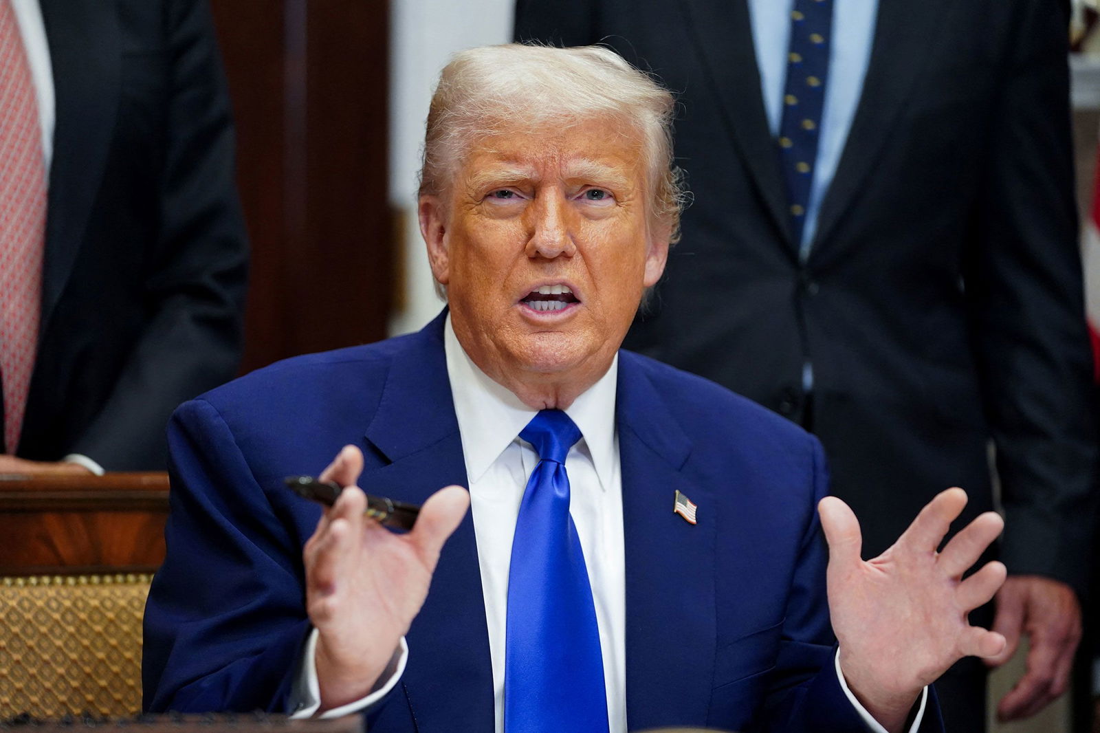 <i>Nathan Howard/Reuters via CNN Newsource</i><br/>U.S. President Donald Trump gestures on the day he signs an executive order on prescription drug pricing during a press conference in the Roosevelt Room at the White House in Washington