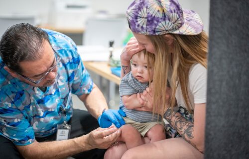 Raynard Covarrubio administers an MMR vaccine at a vaccine clinic in Lubbock